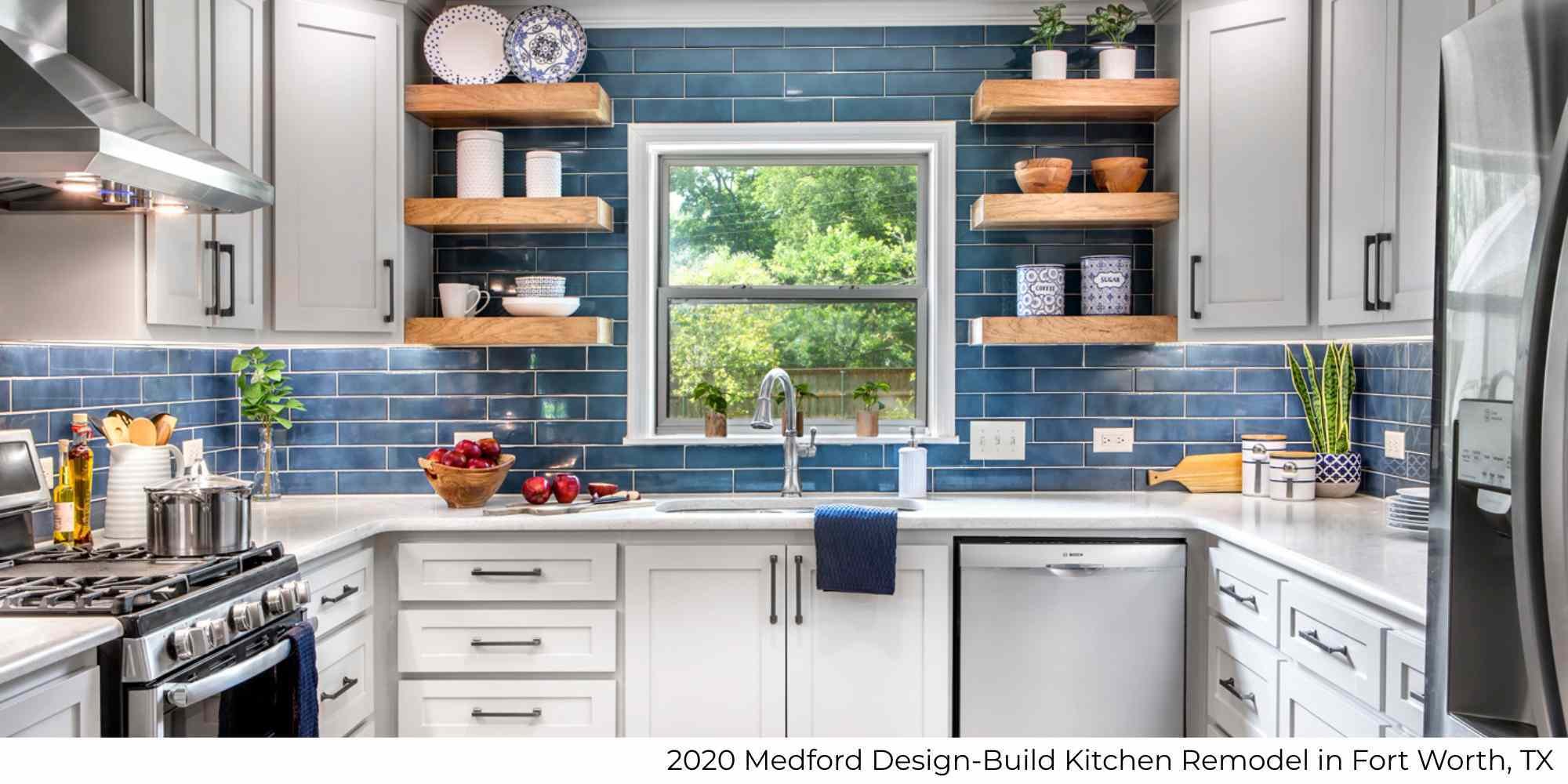 A remodeled kitchen in a whole home remodel with a blue tile backsplash and white cabinetry by Medford Design-Build in Fort Worth, TX