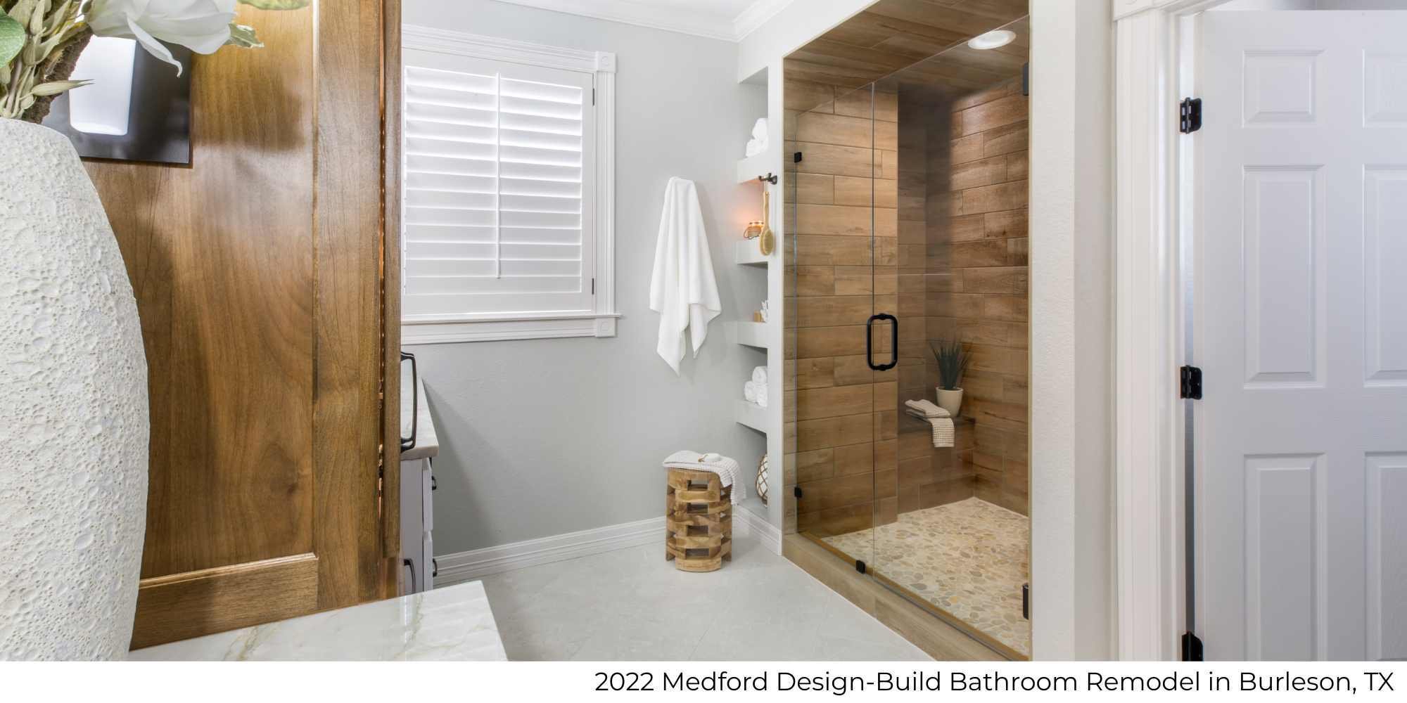 Modern bathroom remodel by Medford Design-Build in Burleson, TX featuring a frameless walk-in shower