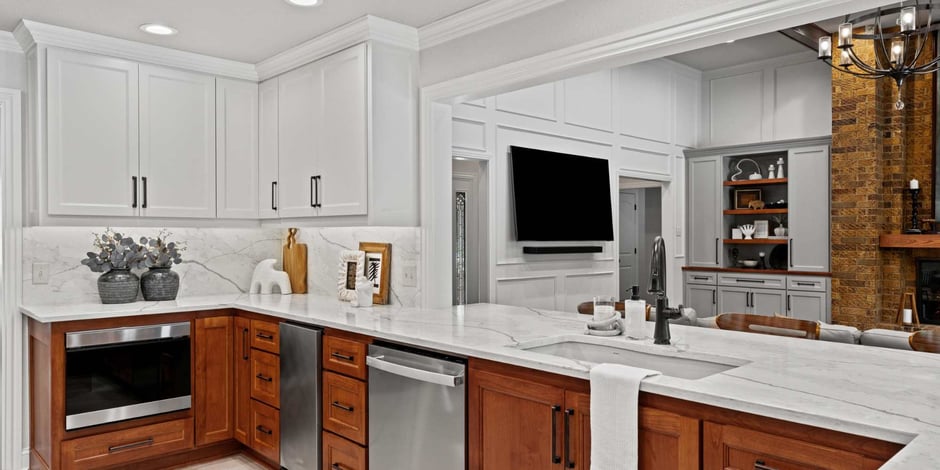 Arlington, TX home remodel by Medford Design-Build featuring white uppers and rich wood base cabinets