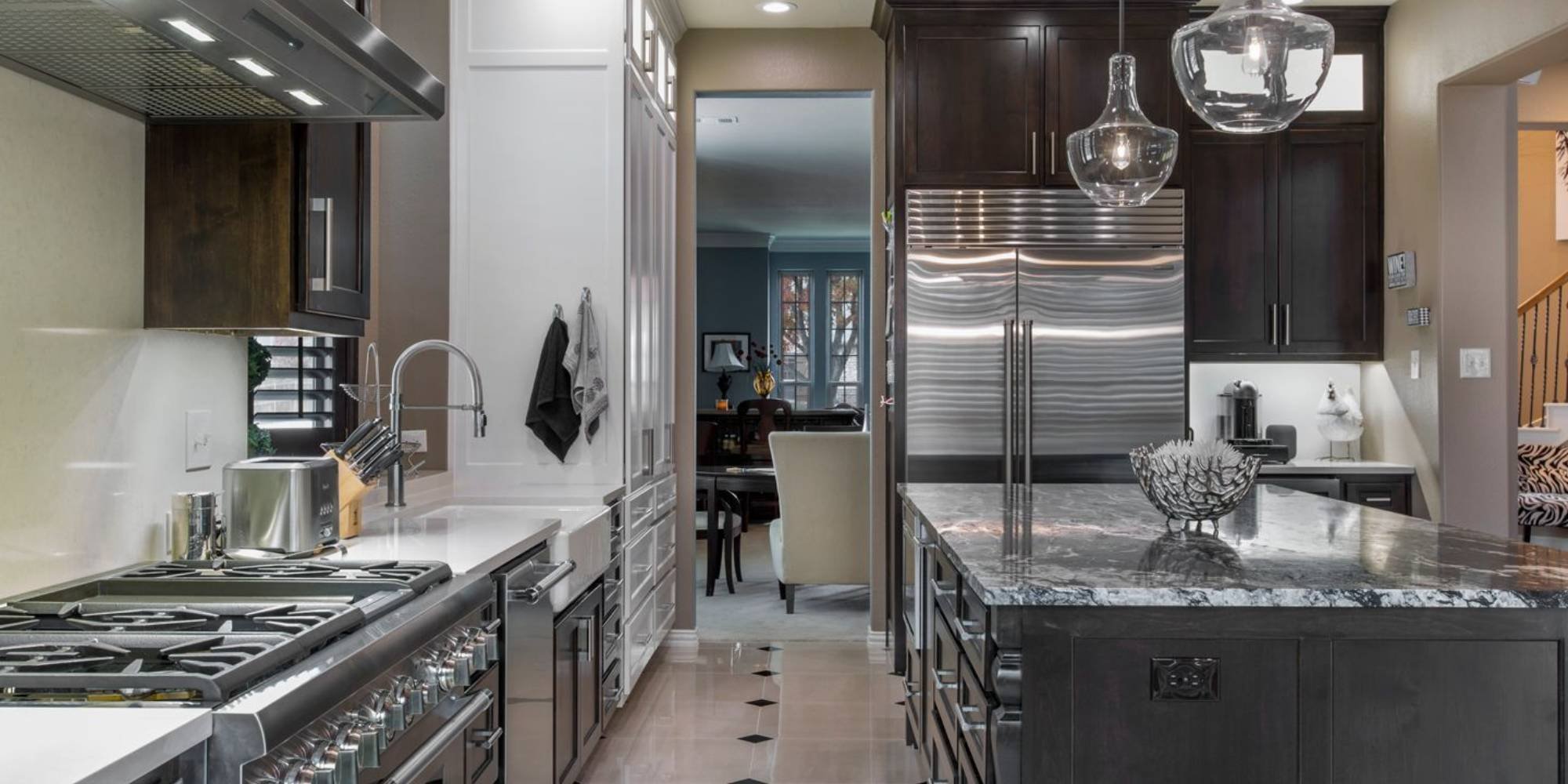 Medford Design-Build kitchen in Tarrant County with black cabinetry, marble countertops, and luxury stainless steel range