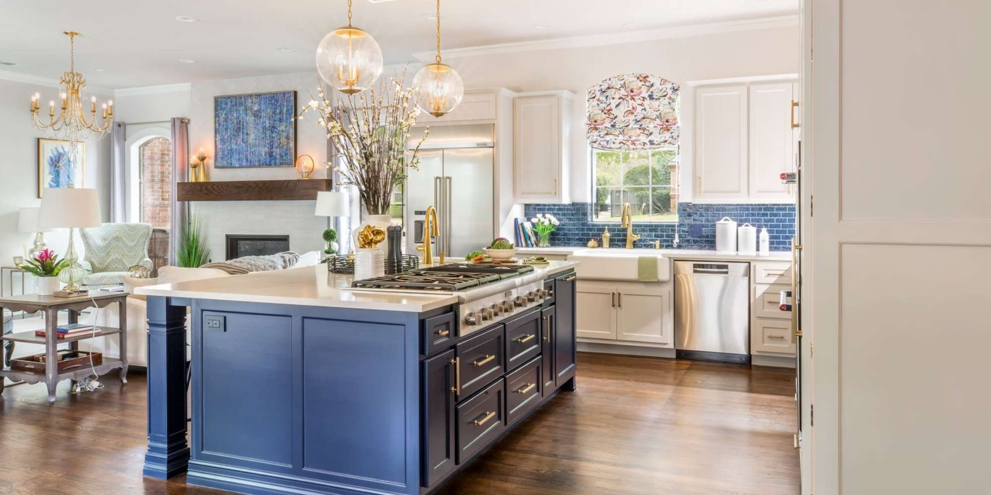 Tarrant County kitchen remodel by Medford Design-Build showcasing modern lighting, navy island, and farmhouse sink