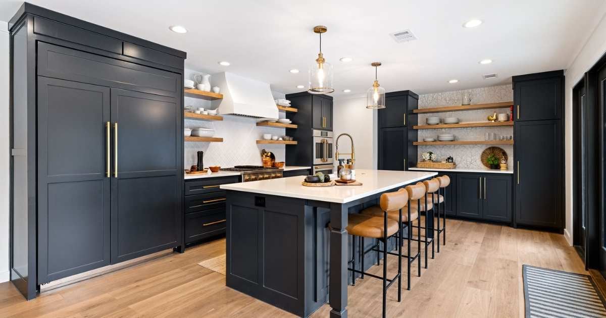 Kitchen remodel with black cabinetry and large central island - Medord Design-Build