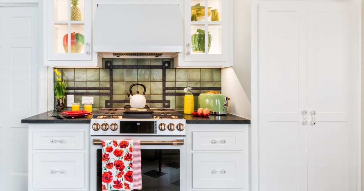 Kitchen remodel with under-cabinet lighting, gas stove, and illuminated counters - Medford
