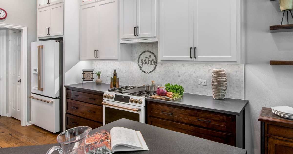 Updated kitchen Arlington with sleek white cabinetry and modern range by Medford