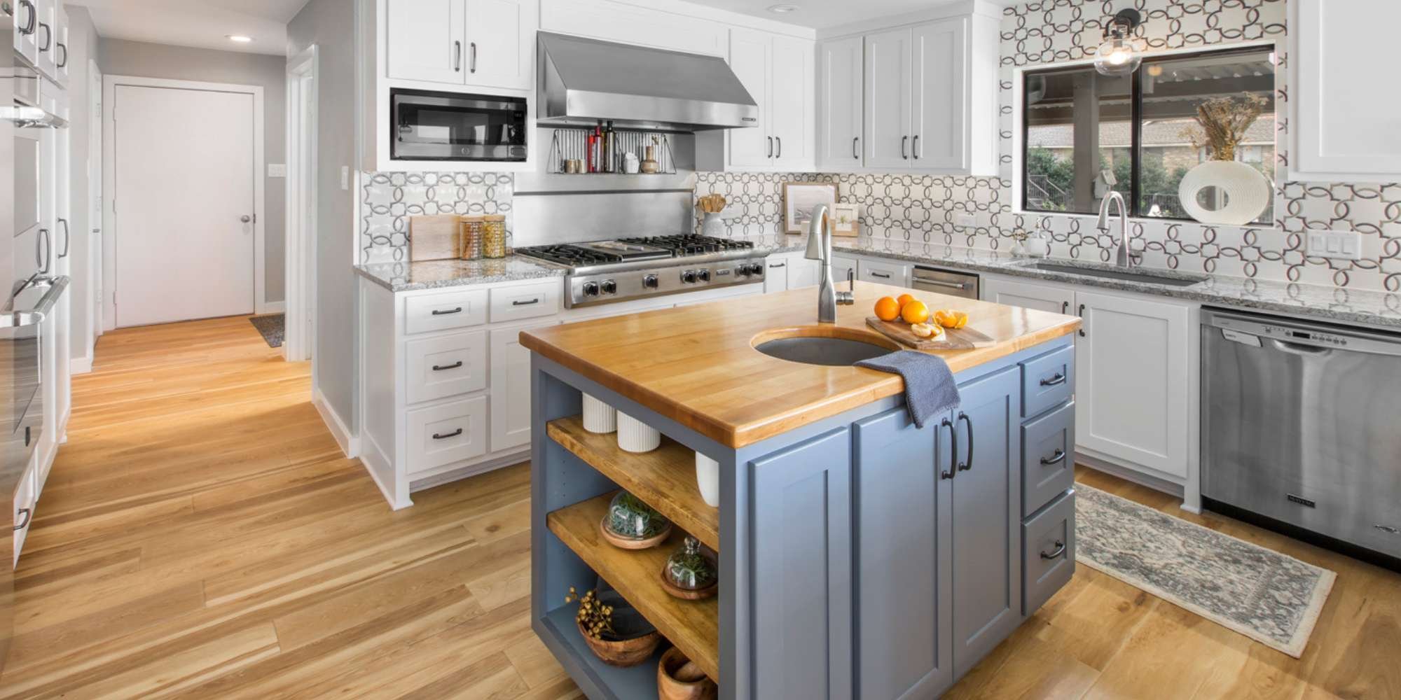 Kitchen remodel with sleek finishes, custom cabinetry, and designer hardware by Medford Design-Build