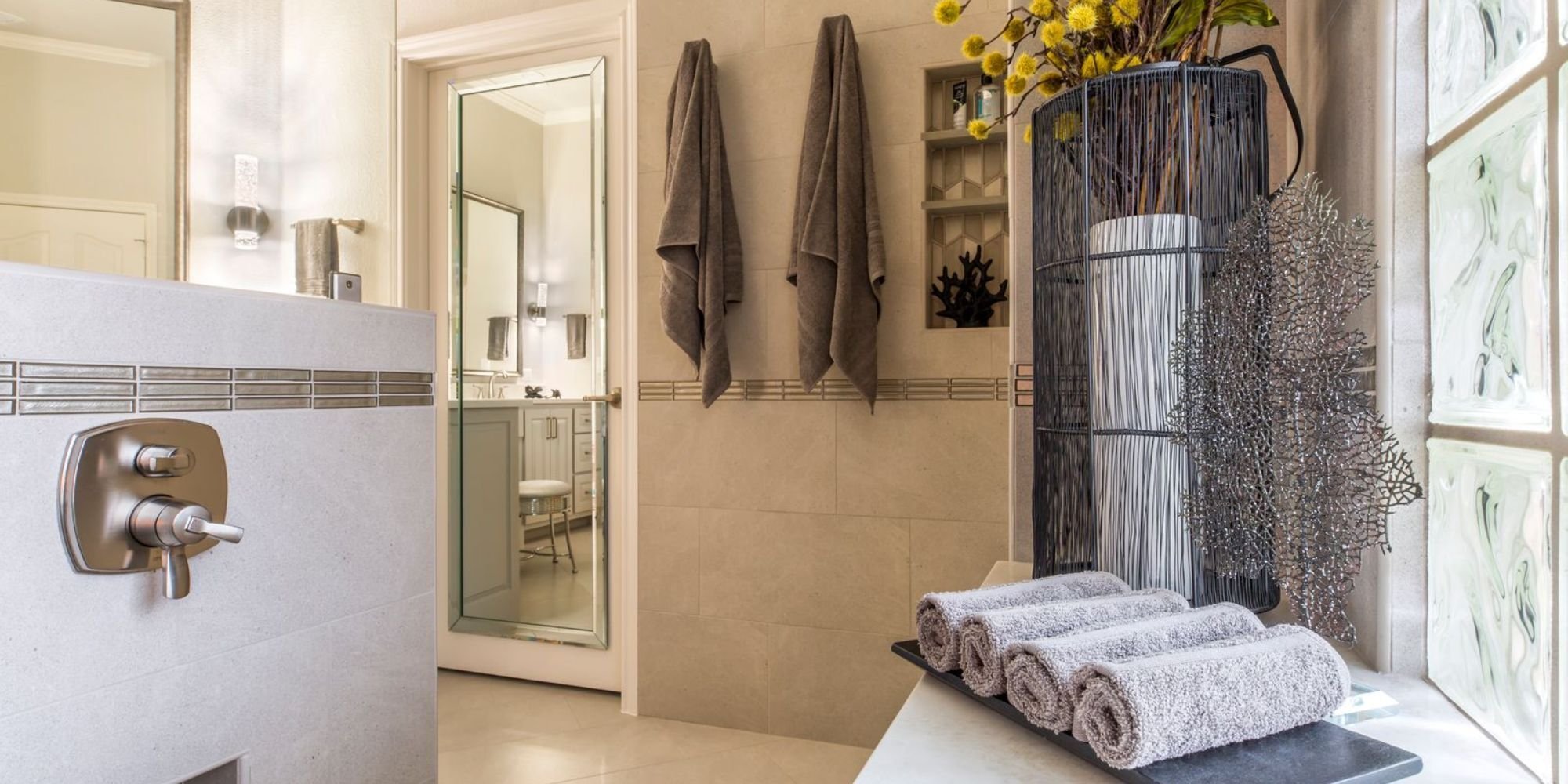 Medford Design-Build bathroom renovation in Arlington, TX featuring neutral tones and glass block window