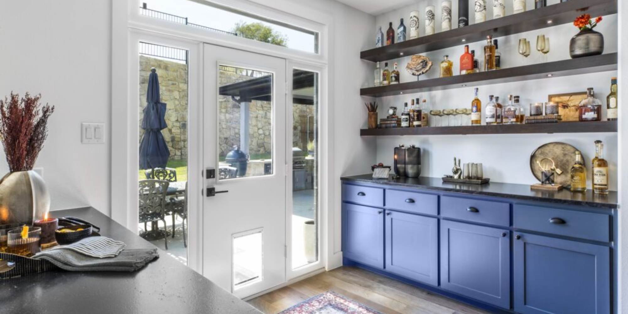 Whole home remodel in Fort Worth with custom bar and blue cabinetry by Medford Design Build