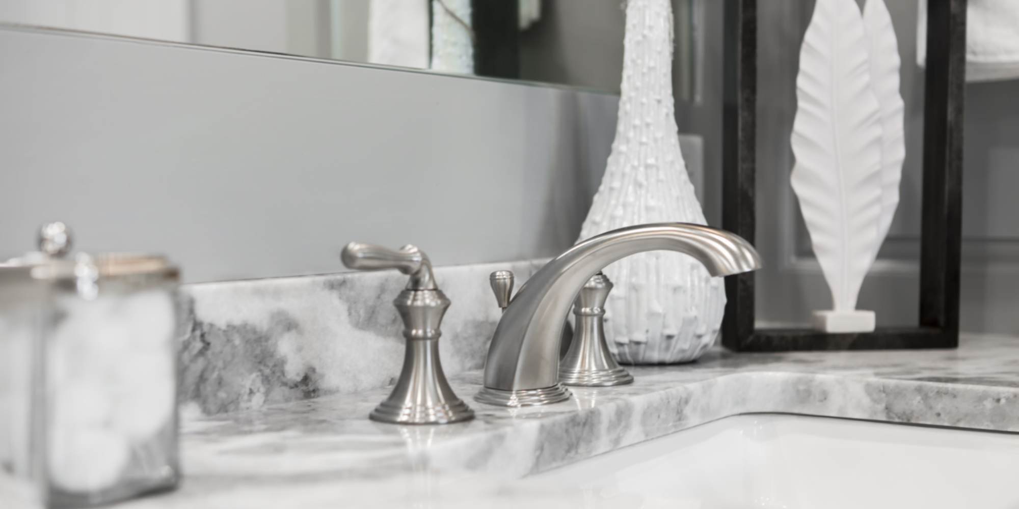 Elegant bathroom sink with silver faucet and decorative accents bathroom remodel in Fort Worth by Medford Design Build