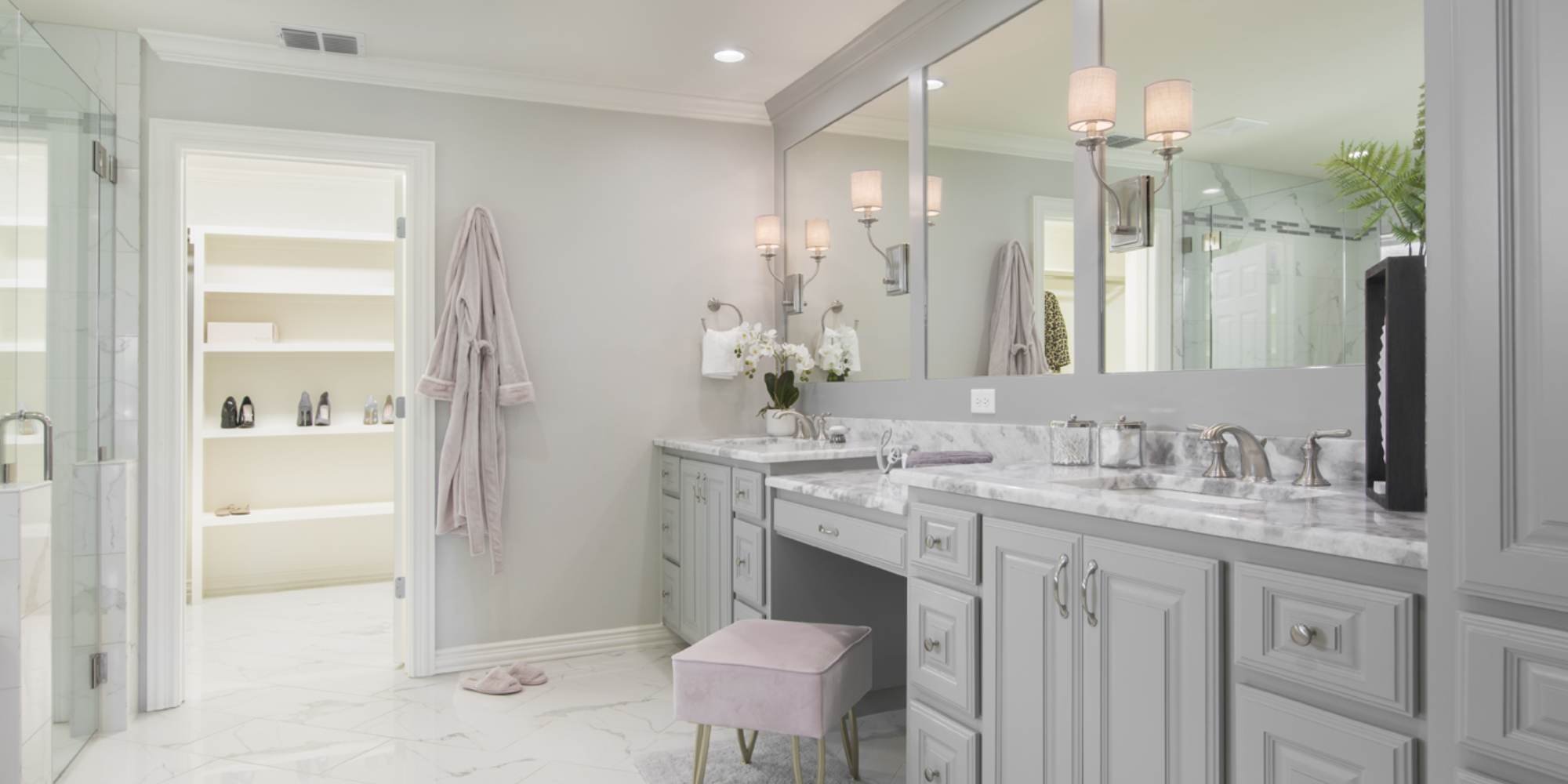 Spacious bathroom remodel in Fort Worth with modern gray cabinetry and lighting by Medford