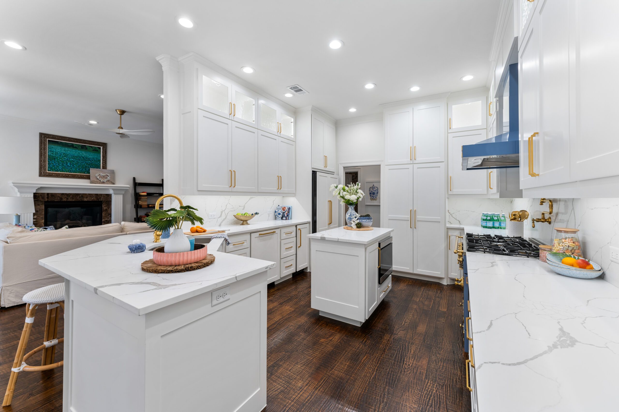 A center island provides additional workspace, while the peninsula now features an overhang for barstool seating.