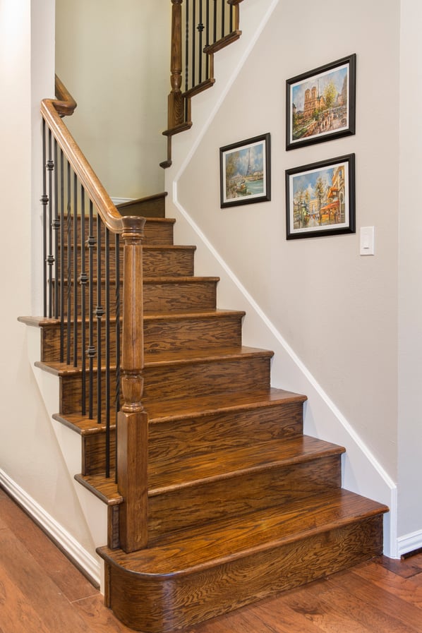 Remodeled staircase with decorative railing.