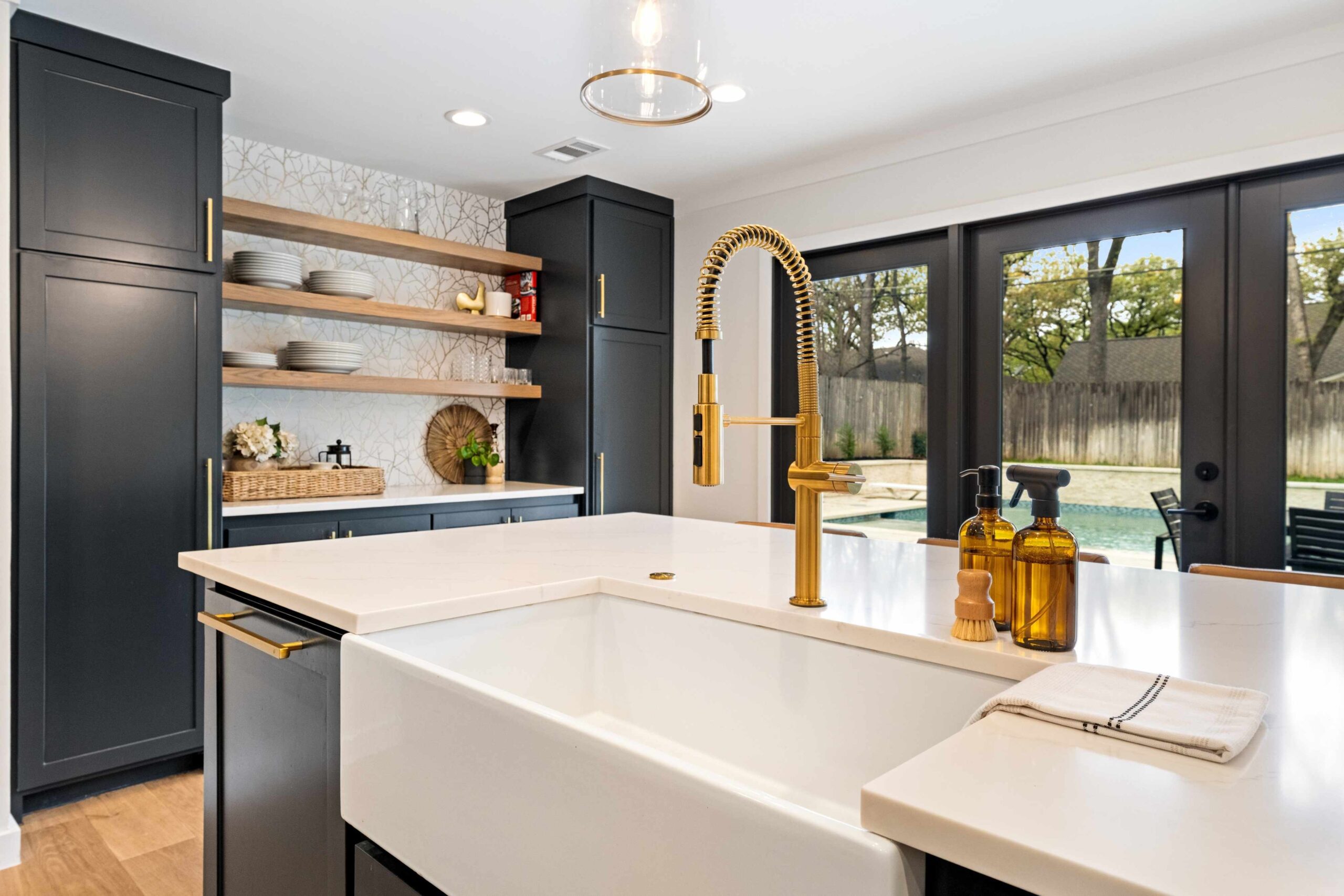 Kitchen: View from Sink of Secondary Wall and Backyard