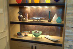 The completed design brightly displays all of the client’s valuable items.