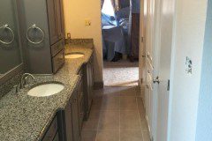 A taller, more slender tower cabinet was installed, providing more storage space for the clients once the fur down ceiling was removed. The low hanging lights were also removed, and replaced with can lights to enhance the open-concept design. Crown molding and coordinating paint colors finish the room nicely.