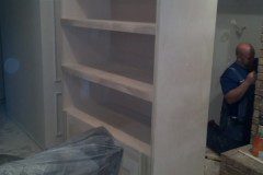 Expert craftsman is installing the lights which will showcase the new display.