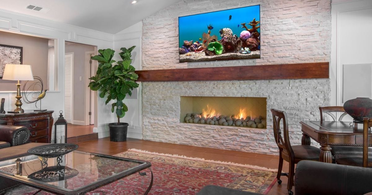 Medford Design-Build living room renovation in Arlington, TX featuring modern fire feature and TV wall