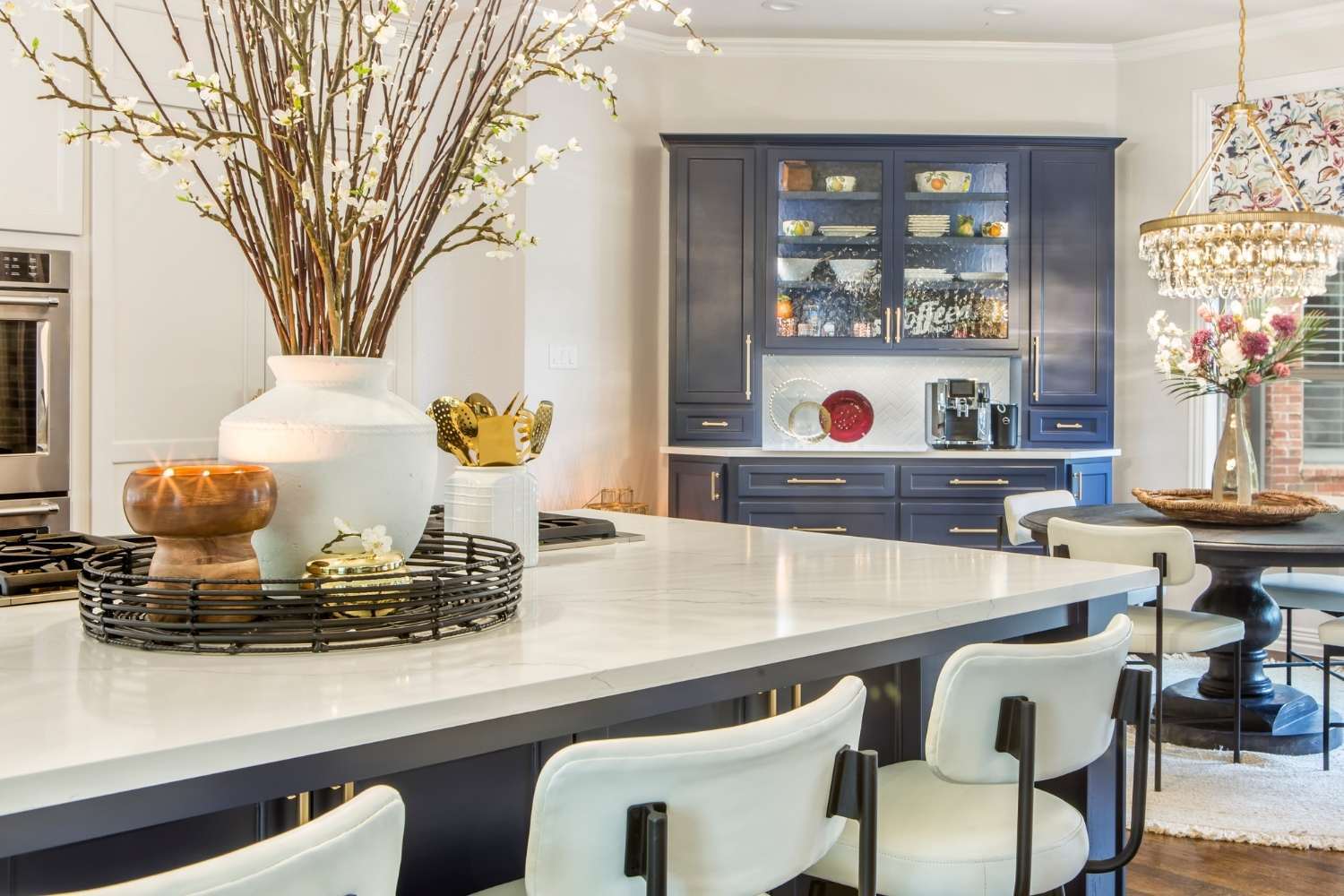Kitchen remodel in Fort Worth, TX by Medford Design-Build featuring built-in bar, seating area, and elegant custom storage