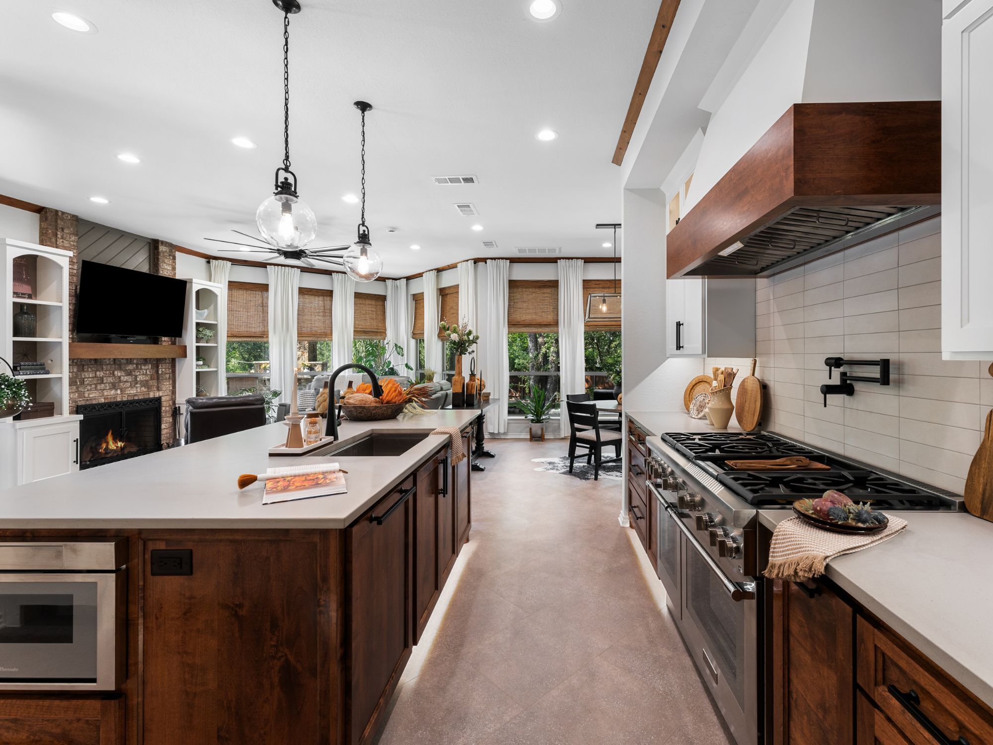 Kitchen remodel in Colleyville, TX with dark wood cabinetry, white countertops, white cabinets, and an island by Medford Design-Build-1 Kitchen remodel in Colleyville, TX with dark wood cabinetry, white countertops, white cabinets, and an island by Medford Design-Build-1